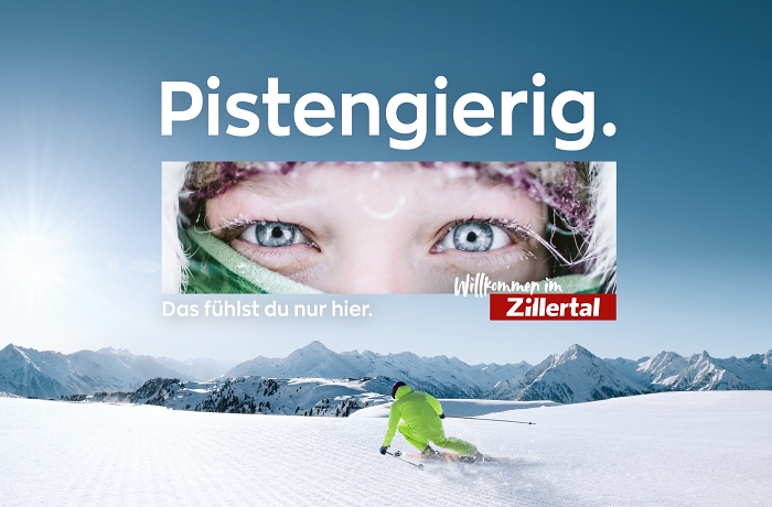 Urlaub im Zillertal. Das Wort "Pistengierig" steht über einem Banner, das die Augenpartie einer Person zeigt. Im Hintergrund ist eine Schnee- und Berglandschaft mit Skifahrer zu sehen.
